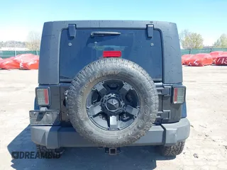 2010 Jeep Wrangler Unlimited Sahara with VIN 1J4HA5H17AL140941, listed as a IAAI auction lot 42004203 with 126,100 mi miles. Bid and sale history available at carsss.com. Image 15.