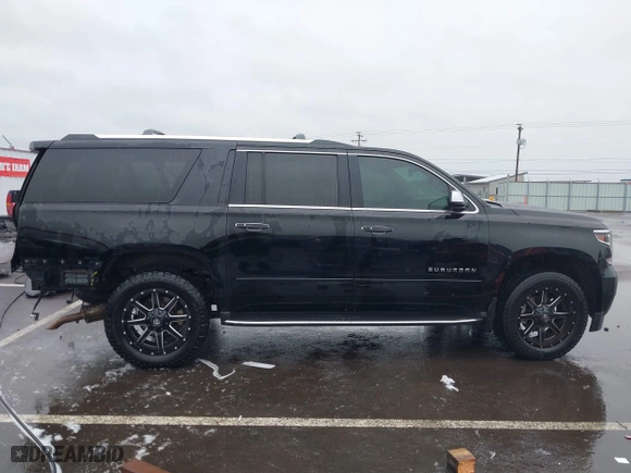 2017 Chevrolet Suburban Premier with VIN 1GNSKJKC4HR162261, listed as a IAAI auction lot 41593672 with 100,136 mi miles. Bid and sale history available at carsss.com. Image 14.