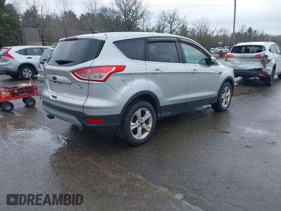 2015 Ford Escape SE with VIN 1FMCU9GX0FUB99881, listed as a IAAI auction lot 41919660 with 138,561 mi miles. Bid and sale history available at carsss.com. Image 4.