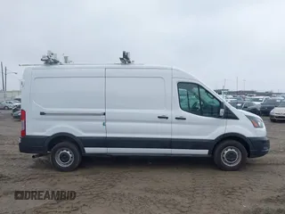 2021 Ford Transit Cargo with VIN 1FTBR1C88MKA52816, listed as a IAAI auction lot 41620731 with 60,716 mi miles and . Bid and sale history available at DreamBid. Image 13.