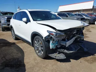 2018 Mazda CX-9 Grand Touring z VIN JM3TCADY6J0229768, wystawiony jako IAAI lot #41724072 z przebiegiem 80 918 mil mil oraz . Historia ofert i sprzedaży dostępna na DreamBid. Obrazek 1.