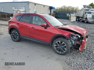 2016 Mazda CX-5 Grand Touring with VIN JM3KE4DY6G0753826, listed as a Copart auction lot 55391555 with 96,852 mi miles and Salvage Title. Bid and sale history available at DreamBid. Image 4.