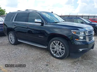 2015 Chevrolet Tahoe LTZ with VIN 1GNSKCKC6FR156244, listed as a IAAI auction lot 42576321 with 156,038 mi miles and . Bid and sale history available at DreamBid. Image 1.