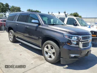 2018 Chevrolet Suburban Premier with VIN 1GNSCJKC4JR189639, listed as a Copart auction lot 64221035 with 110,256 mi miles and Salvage title. Bid and sale history available at DreamBid. Image 4.