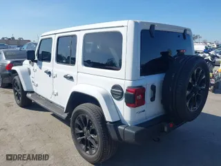 2021 Jeep Wrangler 4xe Unlimited Sahara with VIN 1C4JJXP6XMW765398, listed as a IAAI auction lot 41592185 with 26,834 mi miles. Bid and sale history available at carsss.com. Image 3.