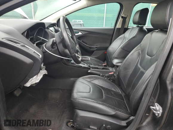 2016 Ford Focus Titanium z VIN 1FADP3N27GL329026, wystawiony jako Copart lot #60910475 z przebiegiem 98 794 mil mil oraz Szkoda całkowita • Salvage title. Historia ofert i sprzedaży dostępna na DreamBid. Obrazek 7.