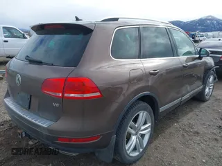 2013 Volkswagen Touareg Lux with VIN WVGEF9BP1DD012851, listed as a IAAI auction lot 41732391 with 123,283 mi miles and . Bid and sale history available at DreamBid. Image 4.
