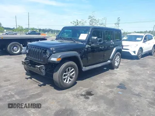 2023 Jeep Wrangler Sport S with VIN 1C4HJXDN5PW671167, listed as a IAAI auction lot 42176127 with 1,230 mi miles and . Bid and sale history available at DreamBid. Image 2.