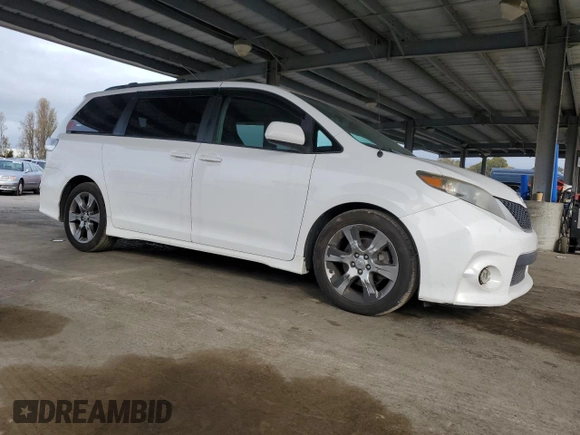 2012 Toyota Sienna SE with VIN 5TDXK3DC9CS215991, listed as a Copart auction lot 51868005 with 215,075 mi miles and Salvage title. Bid and sale history available at DreamBid. Image 4.