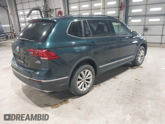 2018 Volkswagen Tiguan SEL with VIN 3VV2B7AX8JM113976, listed as a IAAI auction lot 42310576 with 100,319 mi miles and . Bid and sale history available at DreamBid. Image 4.