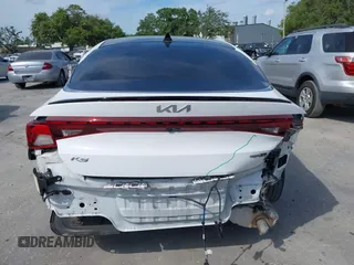 2022 Kia K5 GT-Line z VIN 5XXG64J24NG114772, wystawiony jako IAAI lot #42161747 z przebiegiem 60 761 mil mil oraz . Historia ofert i sprzedaży dostępna na DreamBid. Obrazek 17.