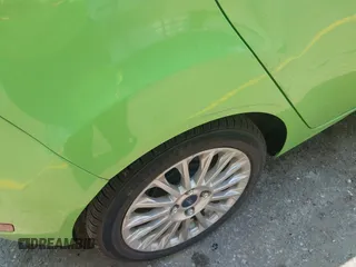 2014 Ford Fiesta Titanium z VIN 3FADP4FJ7EM203322, wystawiony jako IAAI lot #42448840 z przebiegiem 91 901 mil mil oraz . Historia ofert i sprzedaży dostępna na DreamBid. Obrazek 12.