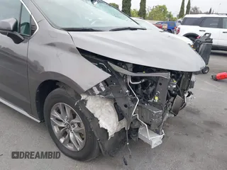 2022 Toyota Sienna LE z VIN 5TDKRKEC1NS099302, wystawiony jako IAAI lot #42243486 z przebiegiem 209 339 mil mil oraz . Historia ofert i sprzedaży dostępna na DreamBid. Obrazek 21.