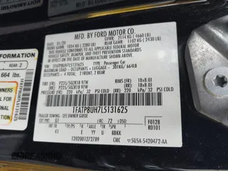 2020 Ford Mustang EcoBoost z VIN 1FATP8UH7L5131625, wystawiony jako IAAI lot #42295906 z przebiegiem 74 572 mil mil oraz . Historia ofert i sprzedaży dostępna na DreamBid. Obrazek 9.