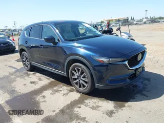 2018 Mazda CX-5 Grand Touring z VIN JM3KFBDM6J0326684, wystawiony jako IAAI lot #42087646 z przebiegiem 111 192 mil mil oraz . Historia ofert i sprzedaży dostępna na DreamBid. Obrazek 1.