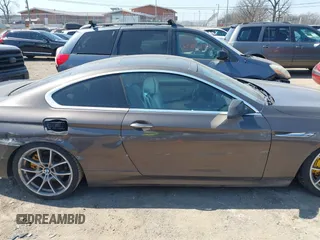 2012 BMW 6 Series 650i z VIN WBALX3C57CC528832, wystawiony jako IAAI lot #41779268 z przebiegiem 75 119 mil mil oraz . Historia ofert i sprzedaży dostępna na DreamBid. Obrazek 13.