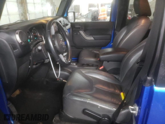 2015 Jeep Wrangler Willys Wheeler with VIN 1C4AJWAG2FL568130, listed as a Copart auction lot 80682914 with 111,686 mi miles and Salvage title. Bid and sale history available at DreamBid. Image 7.