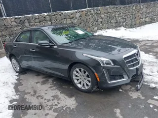 2014 Cadillac CTS AWD z VIN 1G6AW5SX5E0140985, wystawiony jako IAAI lot #41544710 z przebiegiem 131 176 mil mil oraz . Historia ofert i sprzedaży dostępna na DreamBid. Obrazek 1.