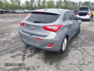 2013 Hyundai Elantra GT with VIN KMHD35LE1DU058318, listed as a IAAI auction lot 42036716 with 146,845 mi miles. Bid and sale history available at carsss.com. Image 4.