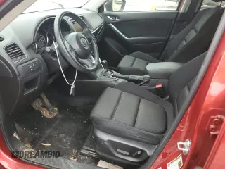 2014 Mazda CX-5 Touring z VIN JM3KE4CY3E0382106, wystawiony jako Copart lot #55521645 z przebiegiem 84 539 mil mil oraz Szkoda całkowita • Salvage title. Historia ofert i sprzedaży dostępna na DreamBid. Obrazek 7.