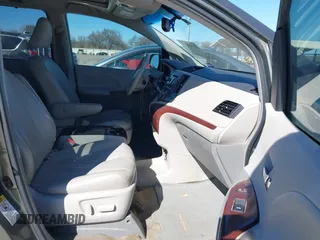 2013 Toyota Sienna XLE AAS with VIN 5TDYK3DCXDS379272, listed as a IAAI auction lot 41407282 with 240,491 mi miles and . Bid and sale history available at carsss.com. Image 5.