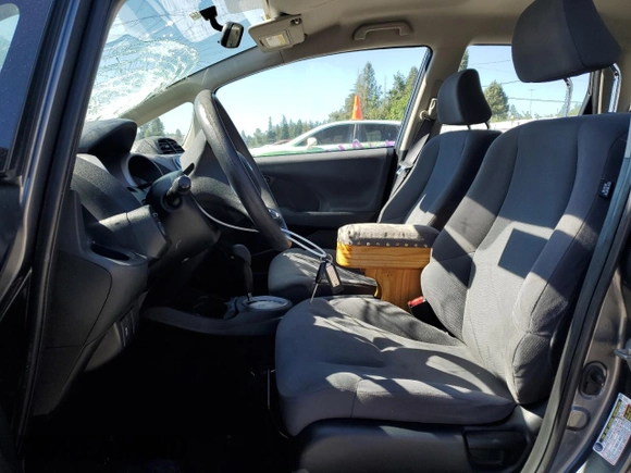 2013 Honda Fit с VIN JHMGE8H34DC069516, выставлен на аукционе Copart как лот 59993335 с пробегом 128 798 миль миль и Списание • Salvage title. История ставок и продаж доступна на DreamBid. Изображение 7.