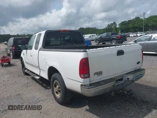 2003 Ford F-150 XL with VIN 1FTRX17L93NB61902, listed as a IAAI auction lot 42096982 with 318,850 mi miles. Bid and sale history available at carsss.com. Image 3.
