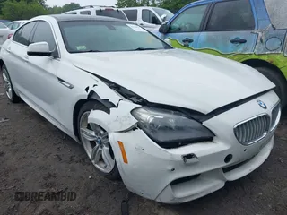 2013 BMW 6 Series 650i z VIN WBA6B2C50DD128385, wystawiony jako IAAI lot #42324831 z przebiegiem 88 255 mil mil oraz . Historia ofert i sprzedaży dostępna na DreamBid. Obrazek 1.