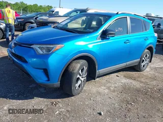 2016 Toyota RAV4 LE with VIN JTMBFREV2GD183811, listed as a IAAI auction lot 42216793 with 95,270 mi miles and . Bid and sale history available at DreamBid. Image 2.