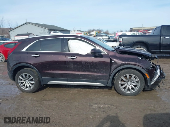 2020 Cadillac XT4 AWD Premium Luxury z VIN 1GYFZDR4XLF085471, wystawiony jako IAAI lot #41528080 z przebiegiem 58 136 mil mil oraz . Historia ofert i sprzedaży dostępna na DreamBid. Obrazek 13.