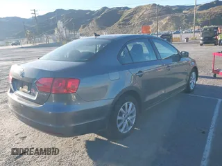 2012 Volkswagen Jetta Sedan SE w/Convenience with VIN 3VWDX7AJ7CM412976, listed as a IAAI auction lot 41823799 with 210,248 mi miles. Bid and sale history available at carsss.com. Image 4.