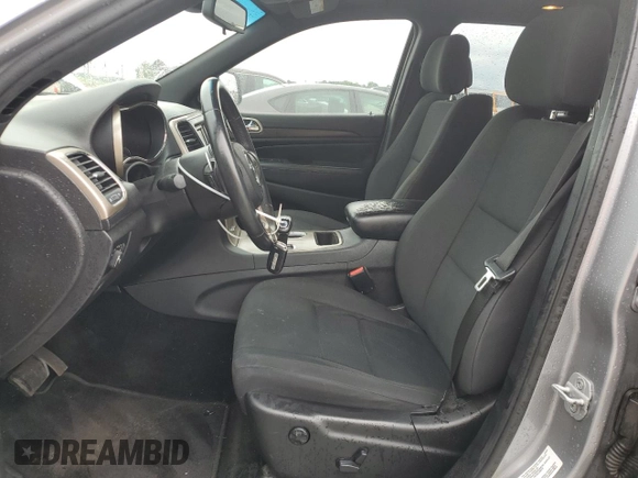 2014 Jeep Grand Cherokee Laredo with VIN 1C4RJEAG2EC179547, listed as a Copart auction lot 53328055 with 107,451 mi miles and Salvage Title. Bid and sale history available at DreamBid. Image 7.