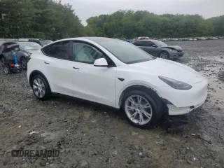 2024 Tesla Model Y Long Range z VIN 7SAYGDEE3RA283311, wystawiony jako Copart lot #56925505 z przebiegiem Nie podano mil oraz Szkoda całkowita • Salvage title. Historia ofert i sprzedaży dostępna na DreamBid. Obrazek 4.