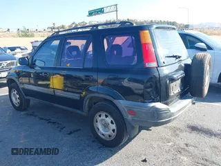 1999 Honda CR-V LX with VIN JHLRD284XXC018161, listed as a IAAI auction lot 41421514 with 209,066 mi miles. Bid and sale history available at carsss.com. Image 3.