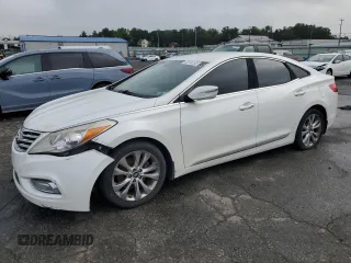 2013 Hyundai Azera z VIN KMHFG4JG8DA228669, wystawiony jako Copart lot #62734185 z przebiegiem 148 611 mil mil oraz Czysty tytuł • Clean title. Historia ofert i sprzedaży dostępna na DreamBid. Obrazek 1.
