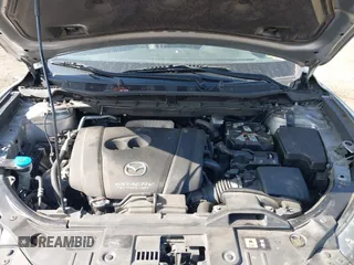 2014 Mazda CX-5 Grand Touring with VIN JM3KE4DY7E0311893, listed as a IAAI auction lot 42090872 with 102,154 mi miles and . Bid and sale history available at DreamBid. Image 10.