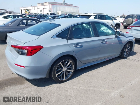 2023 Honda Civic Touring with VIN 2HGFE1F92PH322377, listed as a IAAI auction lot 42361473 with 43,533 mi miles and . Bid and sale history available at DreamBid. Image 4.