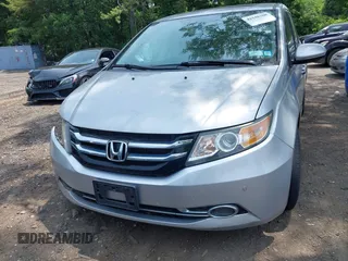2014 Honda Odyssey Touring with VIN 5FNRL5H97EB054158, listed as a IAAI auction lot 42548360 with 91,161 mi miles and . Bid and sale history available at DreamBid. Image 12.