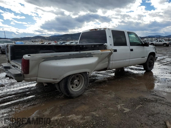 1999 Chevrolet Silverado 3500 z VIN 1GCHC33J2XF087634, wystawiony jako Copart lot #58106714 z przebiegiem 205 431 mil mil oraz Czysty tytuł • Clean title. Historia ofert i sprzedaży dostępna na DreamBid. Obrazek 3.