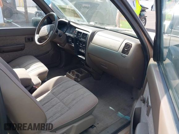 1999 Toyota Tacoma with VIN 4TAVL52N4XZ478703, listed as a IAAI auction lot 42504706 with 34,389 mi miles and . Bid and sale history available at DreamBid. Image 5.