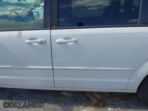 2014 Dodge Grand Caravan SXT with VIN 2C4RDGCGXER322705, listed as a IAAI auction lot 42170301 with 147,070 mi miles and . Bid and sale history available at DreamBid. Image 12.