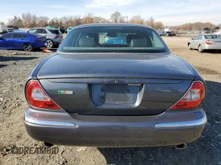 2004 Jaguar XJ with VIN SAJWA73B64TG28182, listed as a Copart auction lot 78380674 with 0 mi miles and Salvage Title. Bid and sale history available at carsss.com. Image 6.