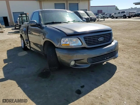 2004 Ford F-150 Heritage Lightning with VIN 2FTRF07354CA69559, listed as a Copart auction lot 73999214 with 256,082 mi miles and Salvage Title. Bid and sale history available at carsss.com. Image 10.