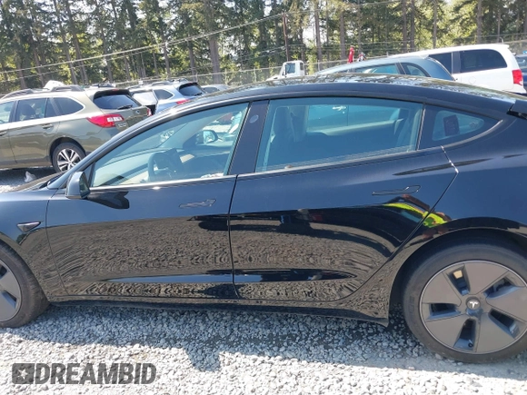 2022 Tesla Model 3 Long Range with VIN 5YJ3E1EB7NF241996, listed as a IAAI auction lot 42115915 with 23,433 mi miles and . Bid and sale history available at DreamBid. Image 14.