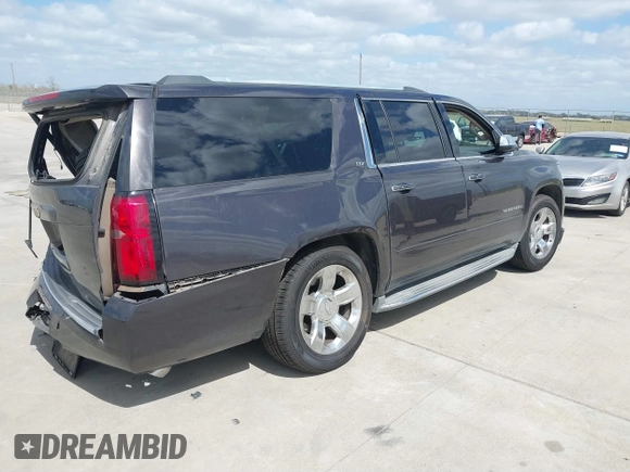 2015 Chevrolet Suburban LTZ with VIN 1GNSCKKC9FR500933, listed as a IAAI auction lot 41830980 with 169,217 mi miles and . Bid and sale history available at DreamBid. Image 4.