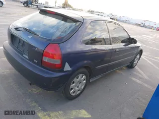 1999 Honda Civic DX with VIN 2HGEJ6446XH111050, listed as a IAAI auction lot 39525349 with 96,566 mi miles. Bid and sale history available at carsss.com. Image 4.