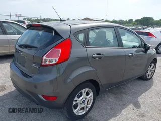 2016 Ford Fiesta SE with VIN 3FADP4EJ4GM129006, listed as a IAAI auction lot 42085892 with 146,044 mi miles. Bid and sale history available at carsss.com. Image 4.