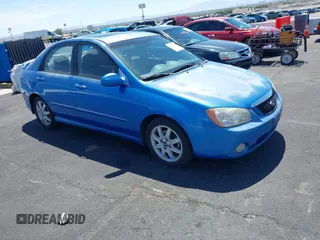 2005 Kia Spectra LX z VIN KNAFE121855155765, wystawiony jako IAAI lot #42509011 z przebiegiem 99 818 mil mil oraz . Historia ofert i sprzedaży dostępna na DreamBid. Obrazek 1.