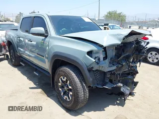 2022 Toyota Tacoma SR with VIN 3TYCZ5AN0NT104300, listed as a IAAI auction lot 42652503 with 18,071 mi miles and . Bid and sale history available at DreamBid. Image 1.