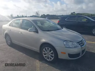 2010 Volkswagen Jetta Sedan Limited with VIN 3VWAX7AJXAM165193, listed as a IAAI auction lot 41962307 with 62,574 mi miles. Bid and sale history available at carsss.com. Image 1.
